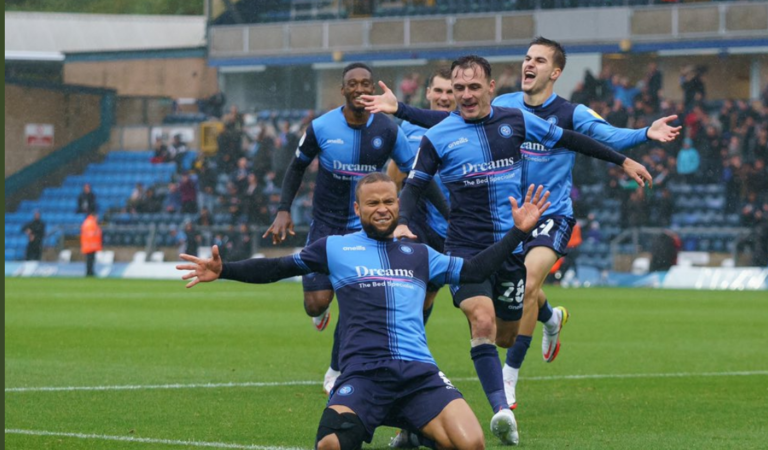 League One round-up: Wigan return to top spot after Portsmouth hammer Sunderland; Wycombe win seven-goal thriller